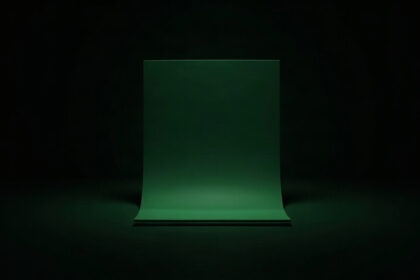 A plain green document shape glowing on a black background