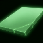 Smooth glowing green rectangular slab with a single seam, floating in darkness
